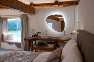 a bathroom with two sinks and a mirror at Chalet Weidehaus De Luxe 