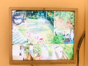 a television screen with a picture of a street at SK Villa in Galle