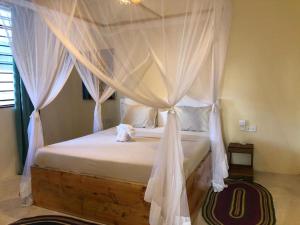 Ένα ή περισσότερα κρεβάτια σε δωμάτιο στο Villa's Tropical Sunset - New opening March 2024