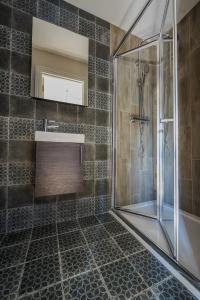 a bathroom with a shower and a sink at The White Horse Hotel in Leiston +46 photos