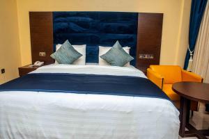 A bed or beds in a room at Otk's Apartment