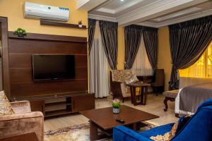 A television and/or entertainment centre at Otk's Apartment