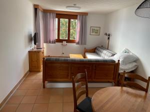 a living room with a couch and a table at Apartment sunny mountains Gerlitzen in Deutschberg