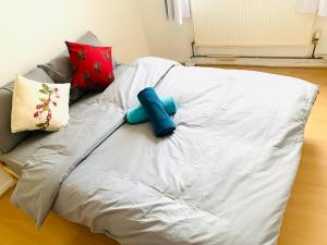 a couch is covered in a white blanket at Double Room Near Tower Bridge 403 in London