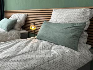 a bedroom with a bed with a pillow and a lamp at Business- Apartment Worms # guesthouse- Monteure willkommen in Worms