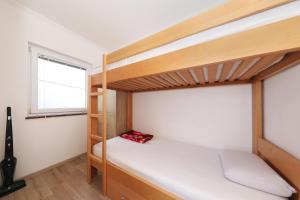 Posteľ alebo postele v izbe v ubytovaní Apartman Sipina 2