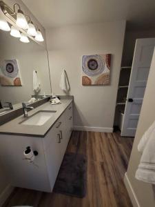 a bathroom with a sink and a mirror at Red Rock Suite - Castle Rock Condos in Richfield