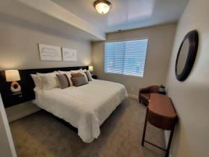 a bedroom with a large bed and a window at Red Rock Suite - Castle Rock Condos in Richfield