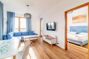 Łóżko lub łóżka w pokoju w obiekcie 3L Apartments Olympic Park