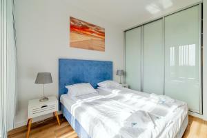 Łóżko lub łóżka w pokoju w obiekcie 3L Apartments Olympic Park