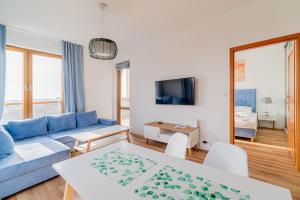Telewizja i/lub zestaw kina domowego w obiekcie 3L Apartments Olympic Park