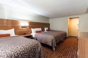 Ένα ή περισσότερα κρεβάτια σε δωμάτιο στο Kalika Hotel