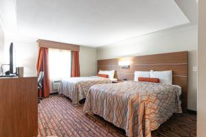 Ένα ή περισσότερα κρεβάτια σε δωμάτιο στο Kalika Hotel