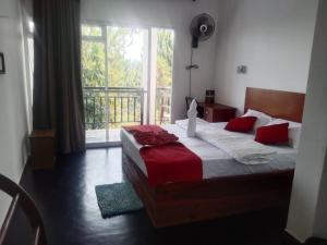 Katil atau katil-katil dalam bilik di T-More Hotel & Hostel