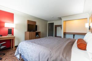 Ένα ή περισσότερα κρεβάτια σε δωμάτιο στο Kalika Hotel