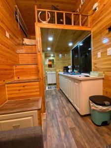 a kitchen with a counter and a sink in a cabin at Tiny House - mountain views close to everything in Valley Center