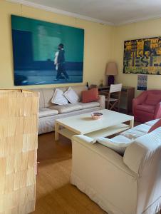 a living room with a couch and a table at Zattere apartment - Casa Gardella in Venice