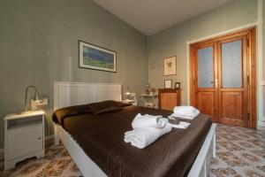 Postel nebo postele na pokoji v ubytování Reyes Suite & Rooms
