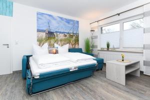 Postel nebo postele na pokoji v ubytování Haus Strandkorb mit Frühstücksoption + 37 fotografií