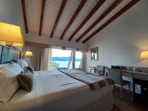 Postel nebo postele na pokoji v ubytování Sol Arrayan Hotel & Spa