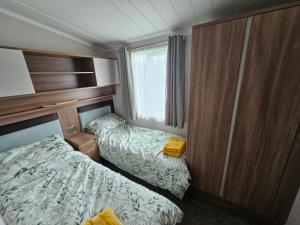 Кровать или кровати в номере The MINI LODGE