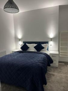 Cama o camas de una habitación en New Sandpiper Apartments