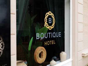 a window with a sign for a boutique hotel at Boutique Hotel in Bad Salzuflen