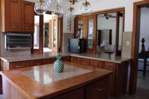 a kitchen with a pineapple sitting on a counter at JuanDolio Guavaberry +3Brd 13p/p in Juan Dolio