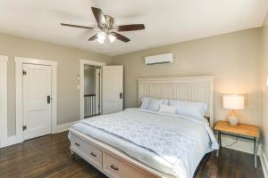 a bedroom with a bed and a ceiling fan at Riverfront Newton Vacation Rental Near Wichita! in Newton