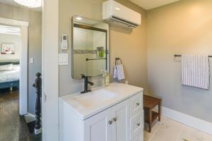 a bathroom with a sink and a mirror at Riverfront Newton Vacation Rental Near Wichita! in Newton +20 photos