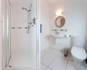 a bathroom with a shower and a toilet and a sink at Luxury ground floor 2 Bedroom apartment Bangor. in Bangor