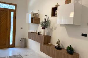 A kitchen or kitchenette at Appartamento in Salento