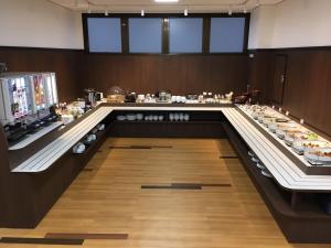 a buffet line in a restaurant with food on display at Hotel Alpha-One Ogori in Yamaguchi