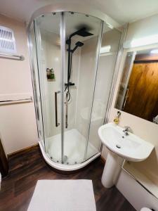 a bathroom with a shower and a sink at Burntisland House in Burntisland