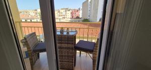 a view of a balcony with a table and chairs at Granada sun in Granada