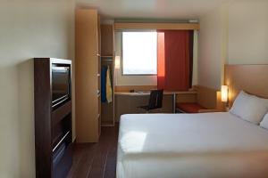 Cama ou camas em um quarto em Ibis Cancun Centro