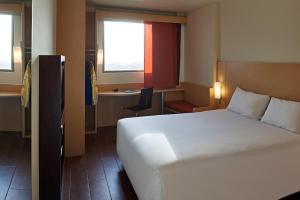 Cama ou camas em um quarto em Ibis Cancun Centro