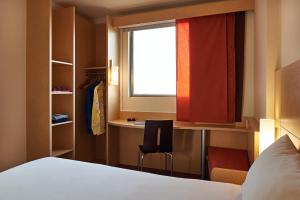 Cama ou camas em um quarto em Ibis Cancun Centro