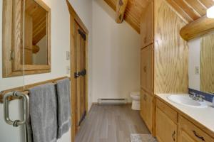 a bathroom with a sink and a toilet at Hand-Crafted Cabin with Whitefish Lake Views! in Whitefish +25 photos