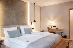 Postel nebo postele na pokoji v ubytování Flair Hotel Werbetal