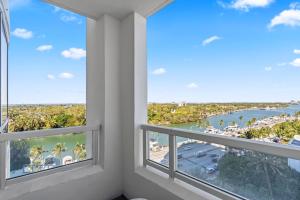 a room with windows with a view of the ocean at Luxury King apartment with Bay View at Miami Beach in Miami Beach