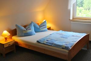 Ένα ή περισσότερα κρεβάτια σε δωμάτιο στο Pension Haus Pentacon