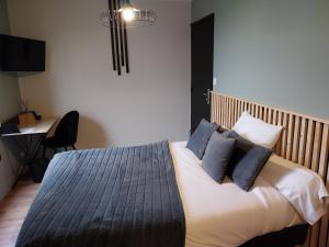 Postel nebo postele na pokoji v ubytování le Ricordeau