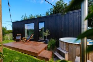 a house with a deck and a hot tub at B-LESS in Blankenberge
