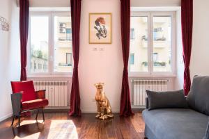 a living room with a dog statue in the corner at IL PRINCIPE - Luxury Boutique Apartment near the COLOSSEO in Rome
