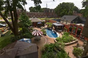 an overhead view of a swimming pool with an umbrella at Mike & Allen's Place on the Park_1 in Columbus