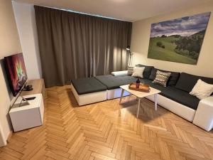 a living room with a couch and a table at Apartman Relax in Zvolen
