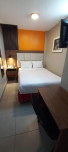 Cama ou camas em um quarto em Hotel Residencial Alfa
