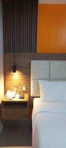 Cama ou camas em um quarto em Hotel Residencial Alfa