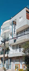 a building with a sign on the side of it at Hotel Las Dalias in Guatapé